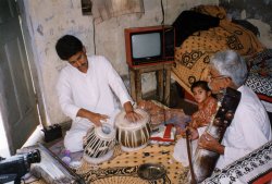 Accompanying his father on tabla